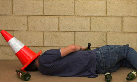 Drunk Student passed out with a traffic cone on his head