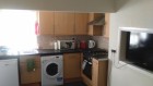 Kitchen equipped with dishwasher, microwave and washing machine / dryer 