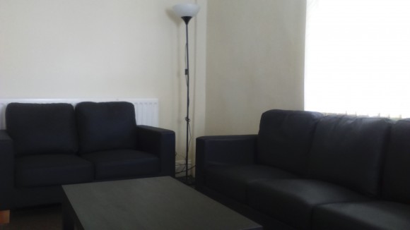 Two spacious couches and coffee table in living room 