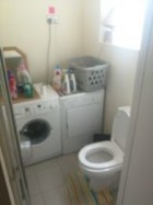 downstairs toilet with washer & dryer