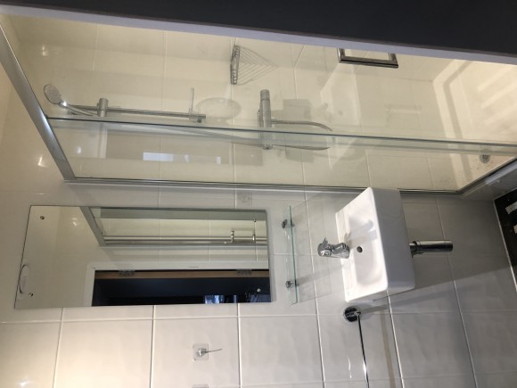 Shower, sink and toilet with storage space 