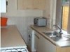 kitchen has a washing machine, fridge/freezer, gas hob, microwave 