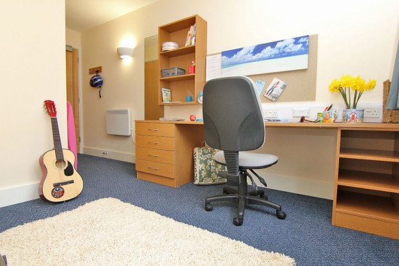 Desk, chair and notice board provided