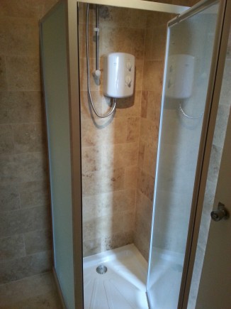 second WC with Shower, hand basin, towel rail and under floor heating