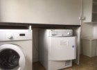 Basement Utility room with washing machine and tumble dryer