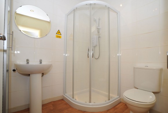 Bathroom provided with shower providing hot water 24/7 by combination boiler and plenty of storage for everyones products!